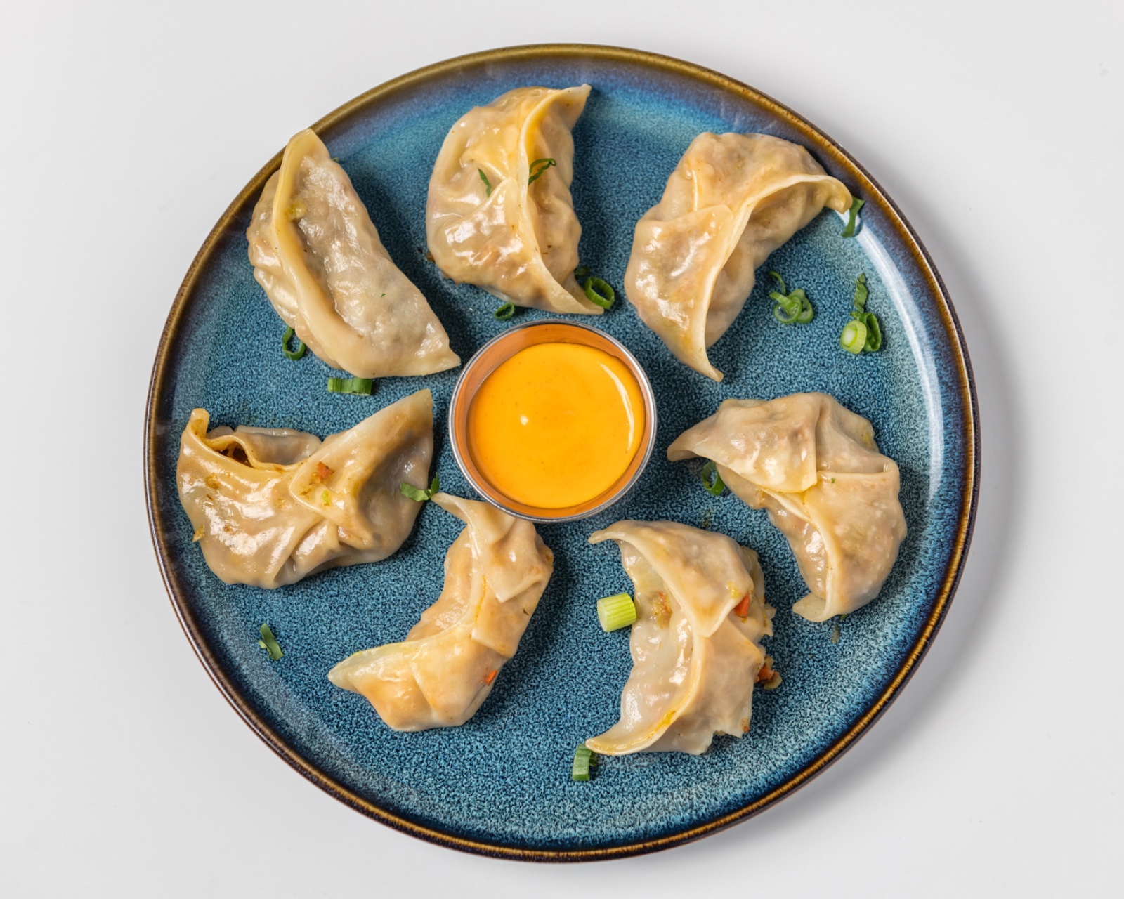 Steam Momos - Delicate steamed dumplings filled with seasoned vegetables or chicken